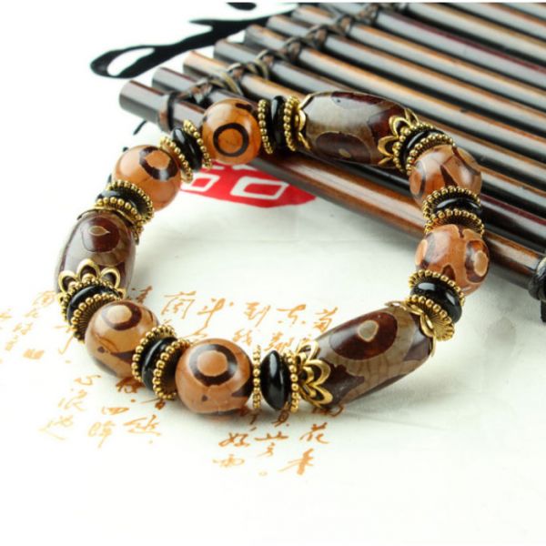 Браслет шесть коричневых трехглазых ДЗИ с кисточкой